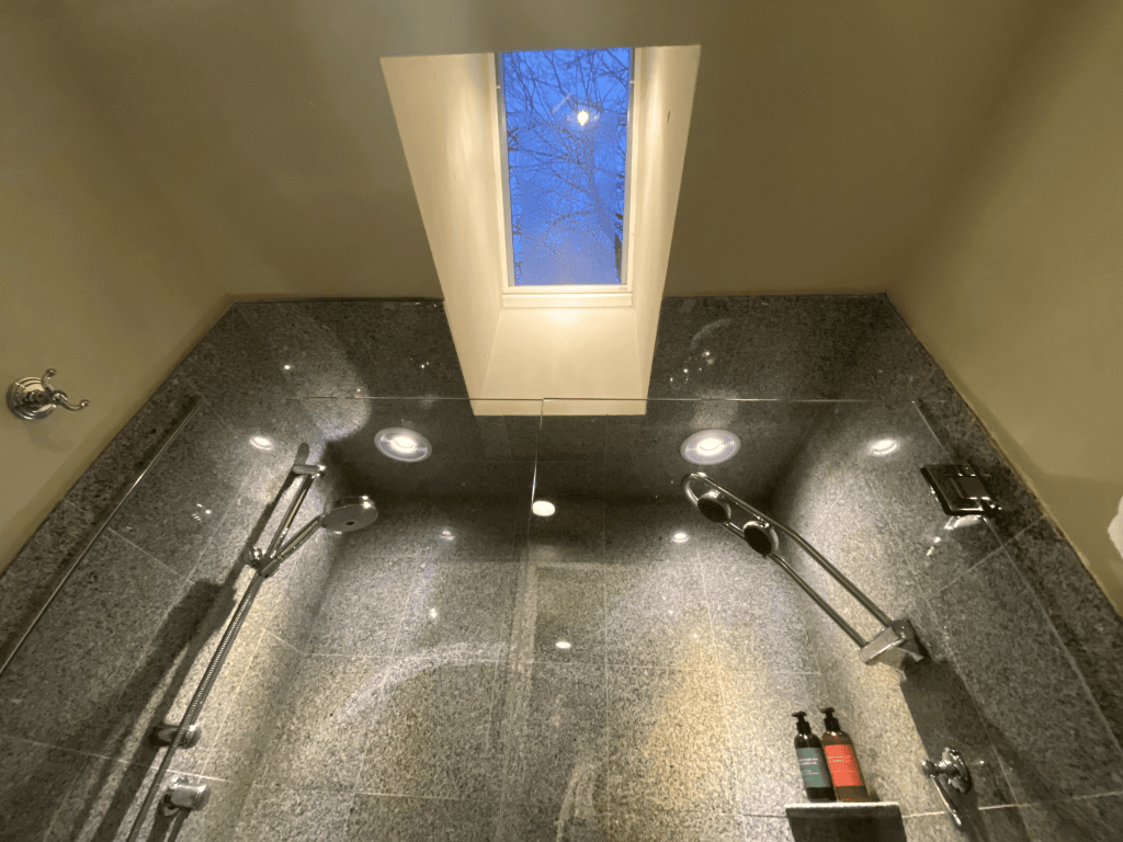 Couple's shower in the Deluxe Garden Room at White Barn Inn