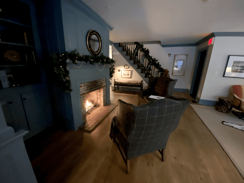 White barn inn sitting area with fireplace